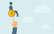 © Visual Generation - Hand pointing to a man in wheelchair icon.