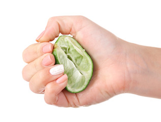 Canvas Print - Female hand squeezing lime isolated on white