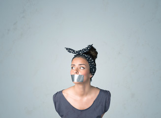 Wall Mural - Young woman with glued mouth