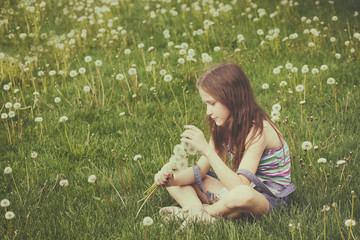 girl with dandelions