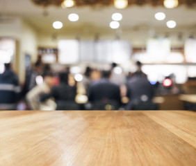 Wall Mural - Table top with blurred Bar with people interior background