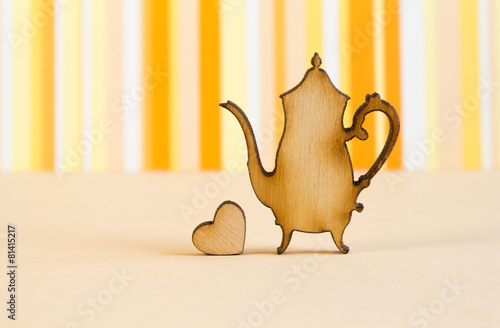 Naklejka dekoracyjna Wooden icon of teapot with little heart on orange striped backgr
