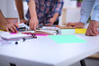 © lenetsnikolai - Young business people working at office on new project
