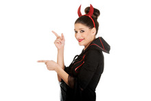Woman In Devil Carnival Costume Pointing Aside.