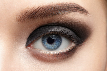 Closeup of beautiful woman eye with makeup, eyeliner