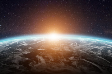 Wall Mural - sunrise over planet earth in space