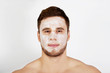 © Piotr Marcinski - Man with cream moisturizer on his face.