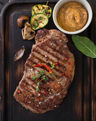 Wall Mural - Beef rump steak on black stone table