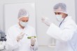 © WavebreakMediaMicro - Scientists injecting an courgette