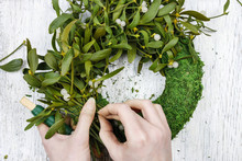 Florist At Work: Woman Making Mistletoe Wreath