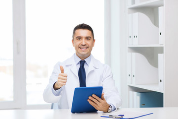 Canvas Print - smiling doctor with tablet pc showing thumbs up