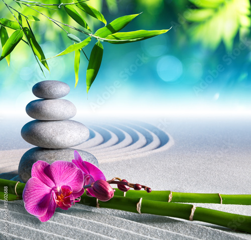 Plakat piasek, orchidea i kamienie do masażu w ogrodzie zen