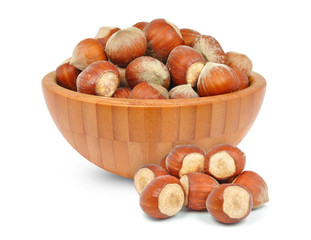 Wall Mural - hazelnuts in a wooden bowl