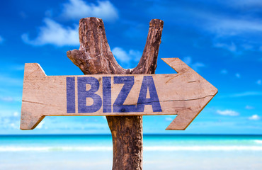 Wall Mural - Ibiza wooden sign with beach background