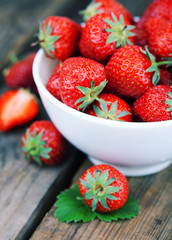 Wall Mural - Strawberries on a wooden.