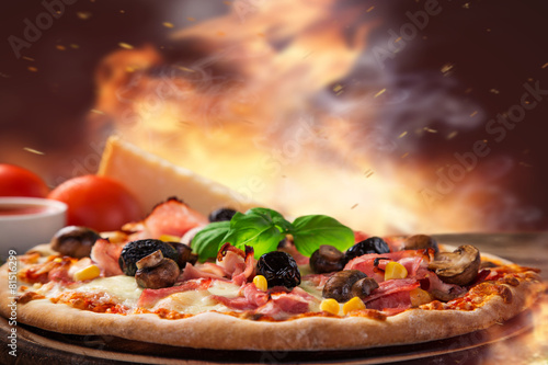 Naklejka nad blat kuchenny Delicious italian pizza served on wooden table