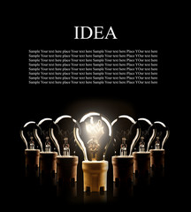 Wall Mural - Light bulbs in row with single one shinning