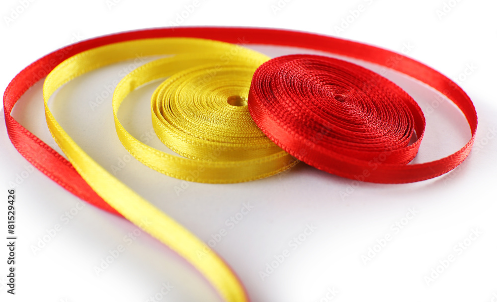 Colorful red and yellow ribbons isolated on white