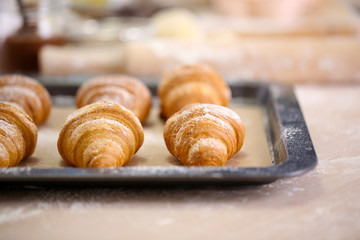 Baking croissant cookies.