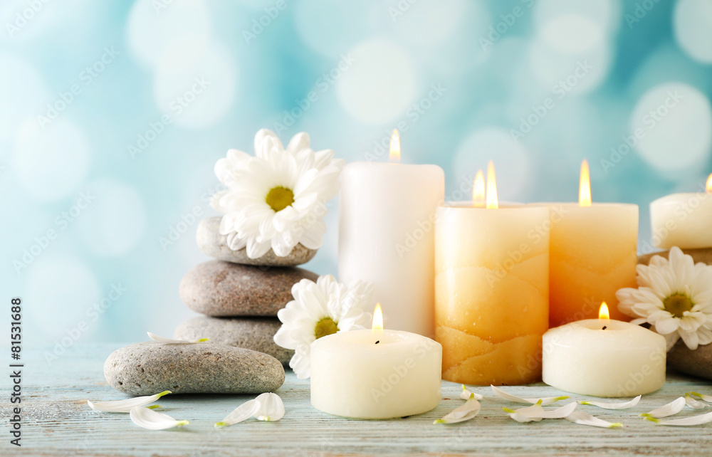Still life with spa candles on light blurred background