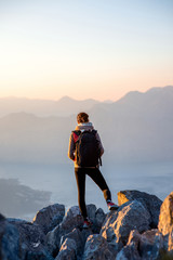 Young photographer on the top of mountain