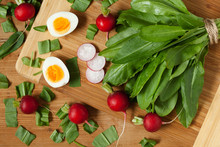 Healthy Spring Vegetables, Sorrel, Radish And Eggs On Wooden
