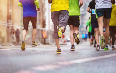 Unrecognizable young runners at the city race