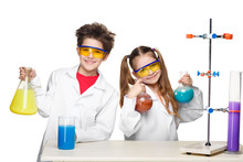Two Cute Children At Chemistry Lesson Making Experiments