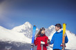 © Halfpoint - Young couple skiing outside in sunny winter mountains