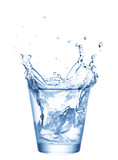 Fototapeta Łazienka - Ice splashing in cup of water
