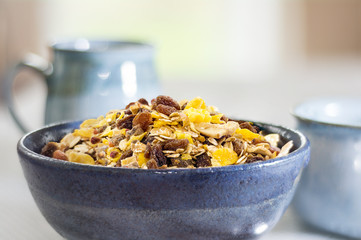 breakfast granola with blue ceramics, shallow depth of field