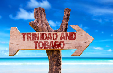 Wall Mural - Trinidad and Tobago wooden sign with beach background