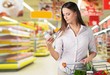 © BillionPhotos.com - Supermarket. Supermarket - Reading the label