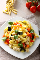 Wall Mural - Pasta with swordfish, zucchini and cherry tomatoes