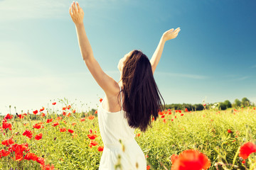 young woman on poppy field