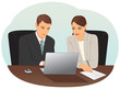© iDraw - Businessman and businesswoman working with laptop in the office