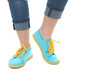 © Studio KIVI - Blue sneakers on girl, young woman legs, isolated