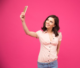 Sticker - Smiling woman making selfie photo on smartphone