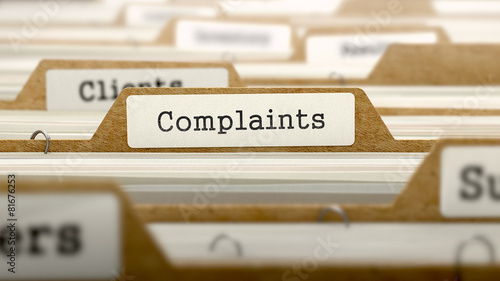 Fotomural Complaints Concept with Word on Folder.