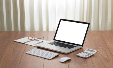 Wall Mural - Blank screen laptop computer with office accessories on wooden t