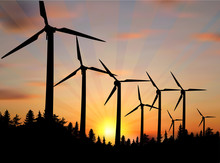 Landscape With Wind Power Generators At Sunset
