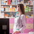 © DC Studio - Pharmacist looking away at her working desk