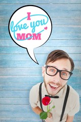 Poster - Composite image of geeky lovesick hipster holding rose