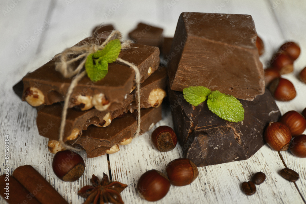 Set of chocolate on wooden table, closeup