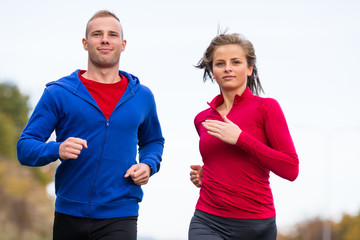 Wall Mural - Healthy lifestyle - woman and man running