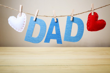 Wall Mural - DAD text and felt hearts hanging on a string