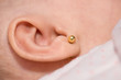 Earring in a baby's ear