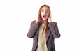 © vdovychenkodenys - Amazed redhead business woman
