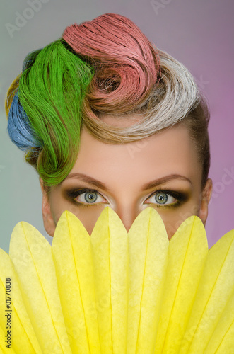 Fototapeta na wymiar Portrait of charming woman with colorful makeup