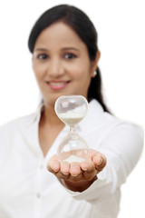 Wall Mural - Business woman holding hourglass